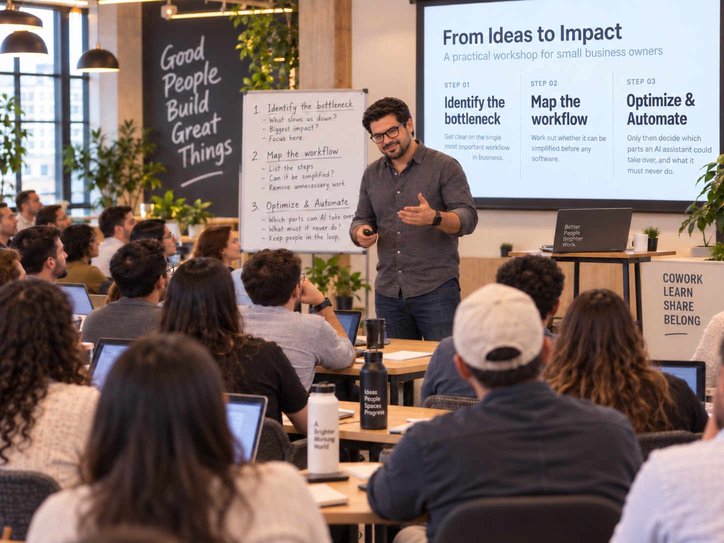 Kevin Conti explains a simple workflow diagram to a small group of business owners